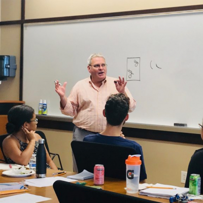 Image of Andrew Causey leading workshop with students