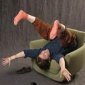 Louise Meintjes upside down in a chair